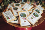 Cardinal Valley Farm rhubarb seed packets on a wooden tray