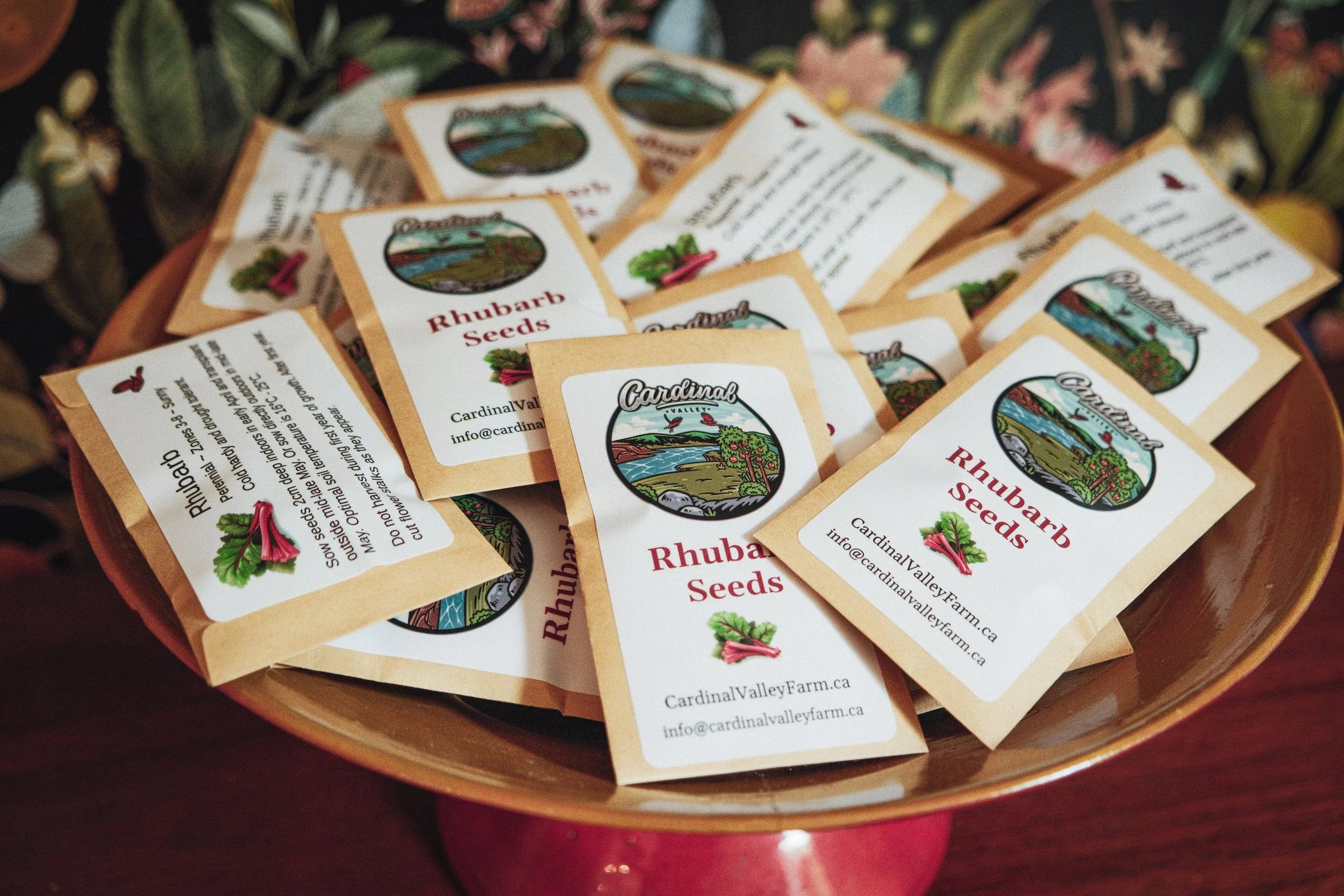 Cardinal Valley Farm rhubarb seed packets on a wooden tray