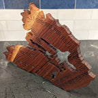 Wooden cribbage board in the shape of Cape Breton, Nova Scotia.